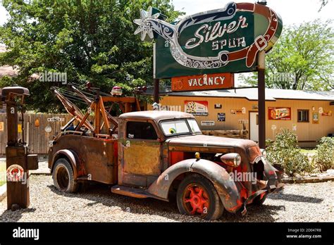 Siver Spur Motel Sign and Antique Truck Display at the Hole in the Rock Tourist stop in ...