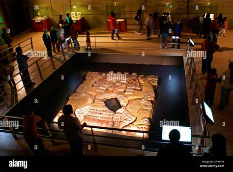 People at the Tlaltecuhtli sculpture exhibit in the Templo Mayor Stock ...