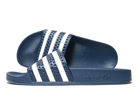 Adidas originals Adilette Slides in Blue | Lyst