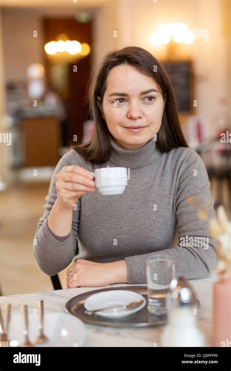 Female tourist enjoying cup of espresso in Viennese coffee house Stock Photo - Alamy