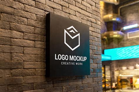 Premium PSD | Logo mockup on black signage board