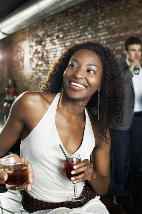 Woman with Cocktail Sitting in Bar Stock Image - Image of cheerful, partying: 31836877