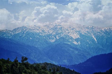 Picture of a Himalayan Mountain with Snow and Clouds on it Stock Image - Image of landscape ...