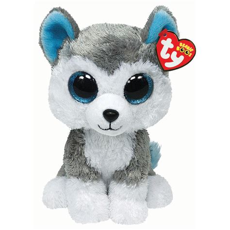 a gray and white stuffed animal with big eyes on it's head, sitting down