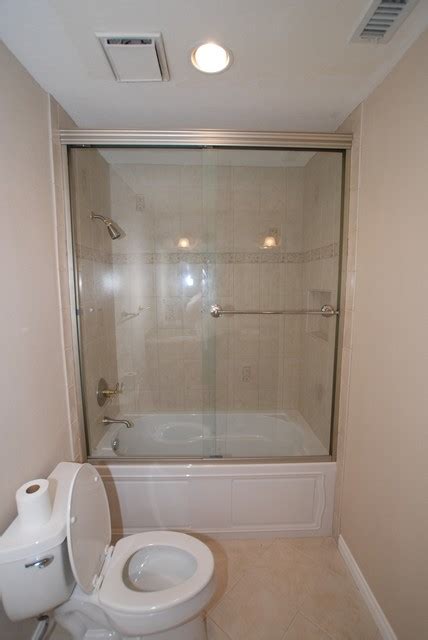 Kohler Devonshire Tub With Recessed Shampoo Shelf & Tall Shower Doors - Traditional - Bathroom ...