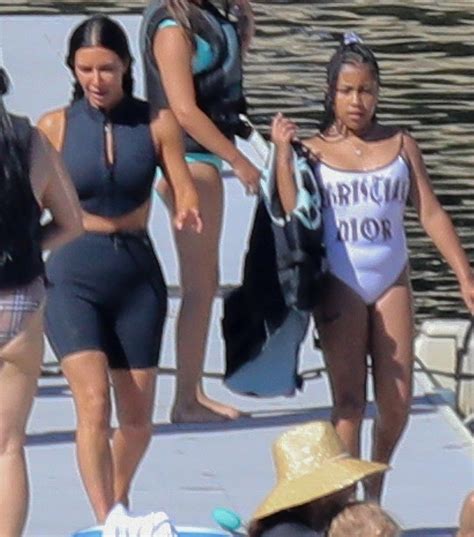 North West rocks pricey vintage Dior swimsuit during Idaho vacation