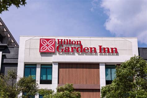 A Logo of Hilton Garden Inn Hotel Chain on a Top of a Building Editorial Photography - Image of ...