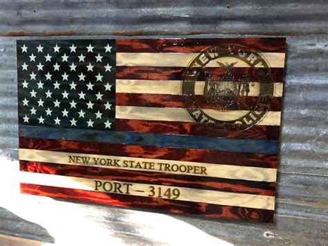 XL Old Glory with a blue line....#sharp we must engrave the #NYSP logo every week on a flag and ...