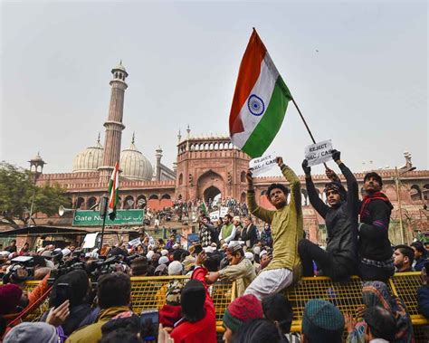 Today's Photo : A protestor holds the national flag during a protest ...