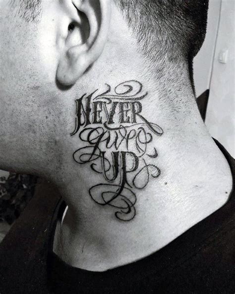 60 Never Give Up Tattoos For Men - Phrase Design Ideas