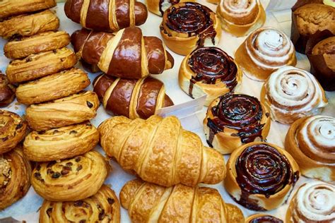 Premium Photo | Fresh baked pastries close-up on a bakery showcase.