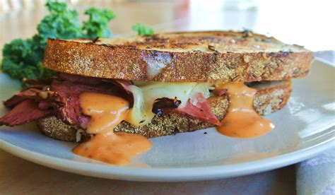 Tasty Reuben Pastrami on Rye Bread Sandwich - No Plate Like Home