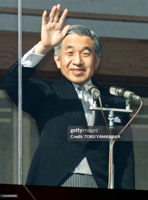 Japanese Emperor Akihito waves to well-wishers through bulletproof... News Photo - Getty Images