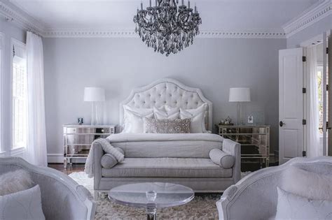 Luxury bedroom with a gray color scheme features a white velvet tufted ...