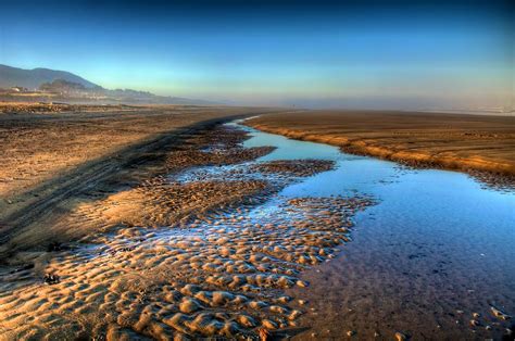 Sunrise At Rockaway Beach Oregon Photograph by Spencer McDonald