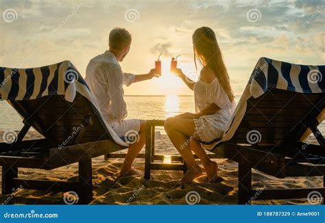 Couple Drinking Cocktails on Beach during Vacation or Honeymoon in Tropics Stock Image - Image ...