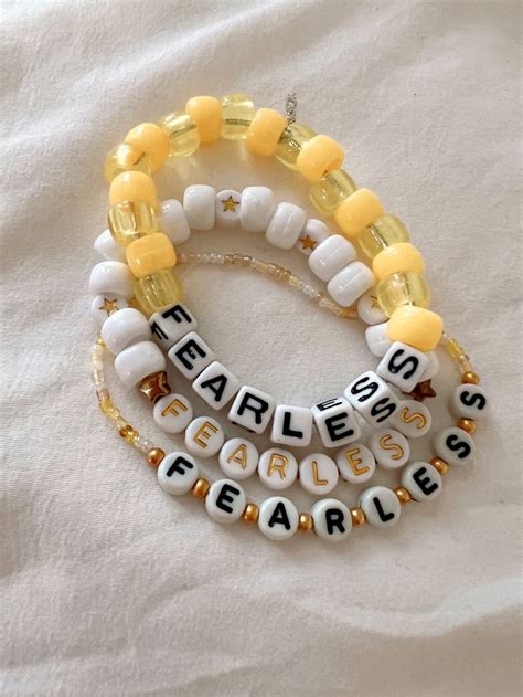 3 yellow and gold beaded bracelets saying fearless for Taylor swift eras tour concert Friendship ...