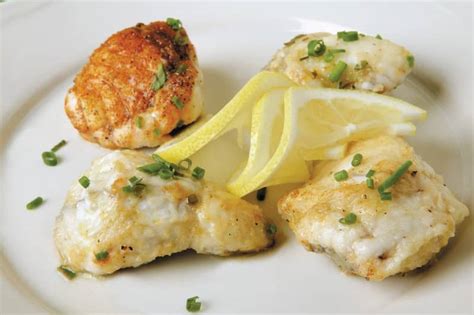 Monkfish Fillet on Plate with Lemon - Prepared Food Photos, Inc.