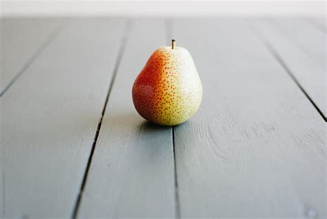 "Forelle Pear On A Grey Table" by Stocksy Contributor "Suzi Marshall ...