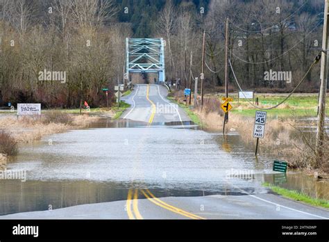 Duvall, WA, USA - March 01, 2022; Flooded NE 124th St in Carnation after the Snoqualmie River ...