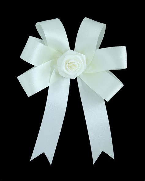 White satin gift bow. Ribbon. Isolated on black with clipping path ...