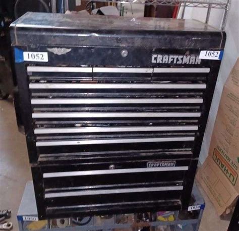 Black Craftsman tool box with two drawer under-box and contents including screwdrivers, vise ...