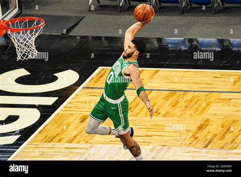 Orlando, Florida, USA, May 5, 2021, Boston Celtics forward Jayson Tatum #0 makes a dunk against ...