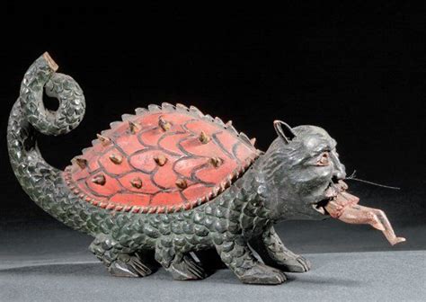 Tarasque de Tarascon. Sculpture en bois polychrome du dragon de Tarascon avalant le corps d'un ...