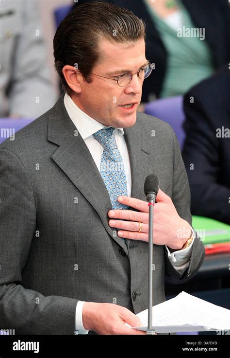 German Minister of Defence Karl-Theodor zu Guttenberg speaks during a ...