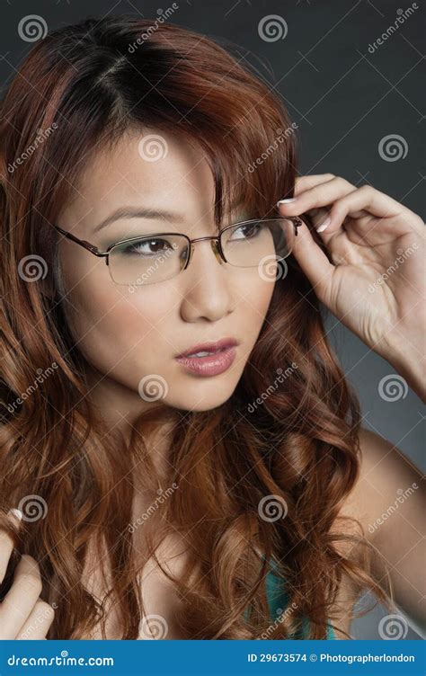 Beautiful Chinese Woman Wearing Glasses Over Colored Background Stock Images - Image: 29673574