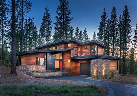 a house in the woods with trees around it