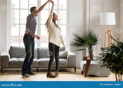 Happy Romantic Couple Dancing In Living Room At Home Together Stock Image | CartoonDealer.com ...