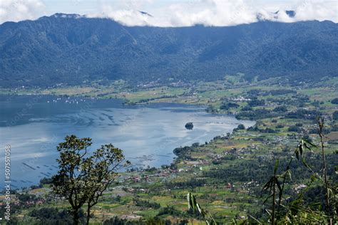 Danau Maninjau is an impressive volcanic lake at the bottom of an immense caldera measuring 20 ...