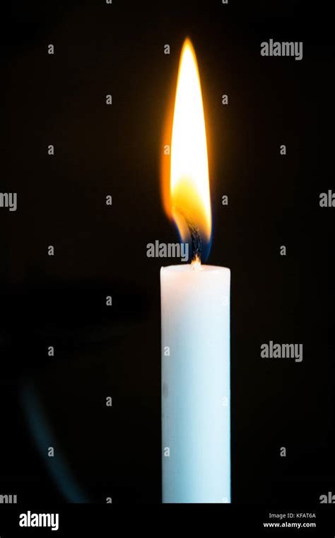 Single candle burning hi-res stock photography and images - Alamy