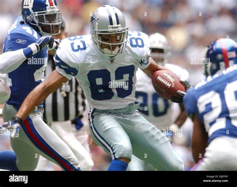 Oct 10, 2004; Irving, TX, USA; NFL Football: Cowboys' Terry Glenn looks for room around Giants ...