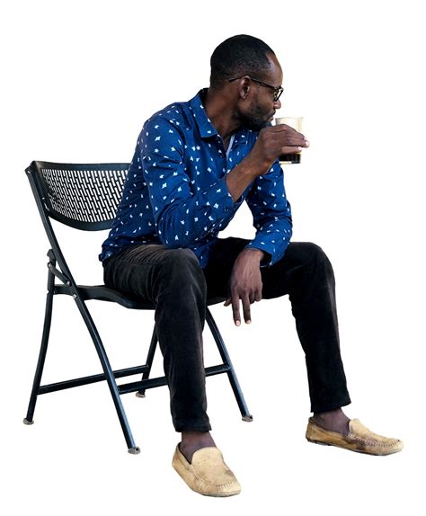 African Man Sitting on a chair drinking coffee - Afrikut