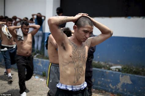 El Salvador's 18th Street gang members pose alongside their guns after ...