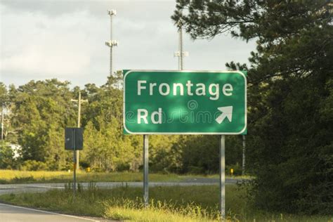 Frontage Road Sign with Arrow Stock Photo - Image of frontage, white: 221038580