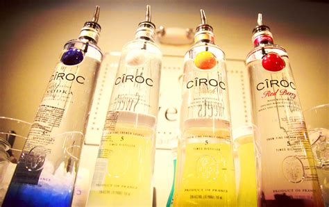Download Ciroc French Vodka Coconut Peach And Red Berry Bottles Wallpaper | Wallpapers.com