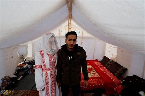 Gaza couple marry in tent city by barbed wire border fence | The Straits Times