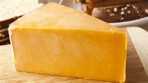 The Fascinating History Behind Why Some Cheese Has That Bright Orange Color