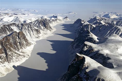 Ice covered fjord on Baffin Island with Davis Strait in the back in ...