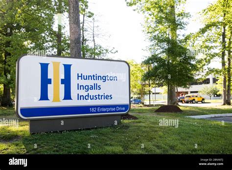 A logo sign outside of a facility occupied by Huntington Ingalls ...