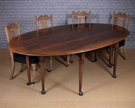 Antiques Atlas - Large Oak Drop Leaf Dining Table.