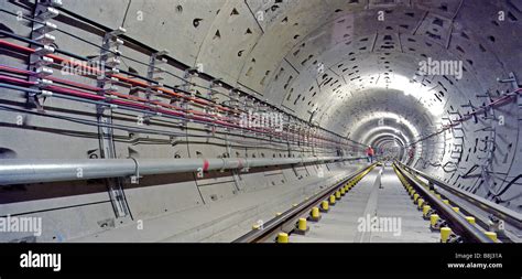 Engineer inspecting newly laid trackwork in a Jubilee Line Extension Stock Photo, Royalty Free ...