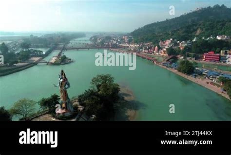 Aerial Shot of Haridwar city showing big statue of Hindu God Lord Shiva ...