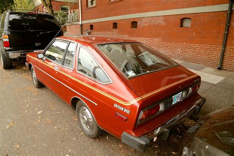 OLD PARKED CARS.: 1979 Datsun 210.