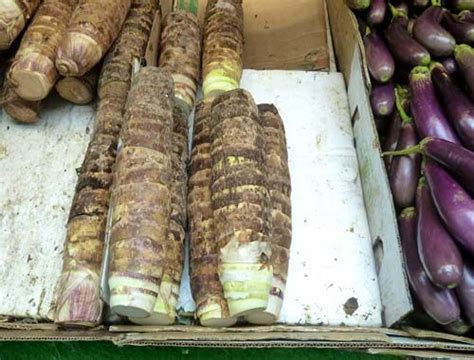 an assortment of vegetables on display at a farmer's market, including ...