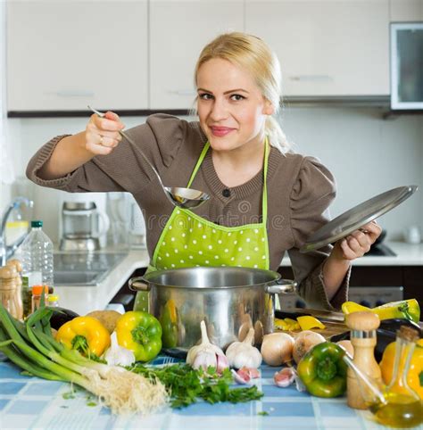 Happy Girl Cooking at Kitchen Stock Image - Image of saucepan, pepper ...