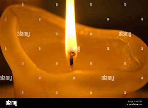 Burning candle flame close up Stock Photo - Alamy